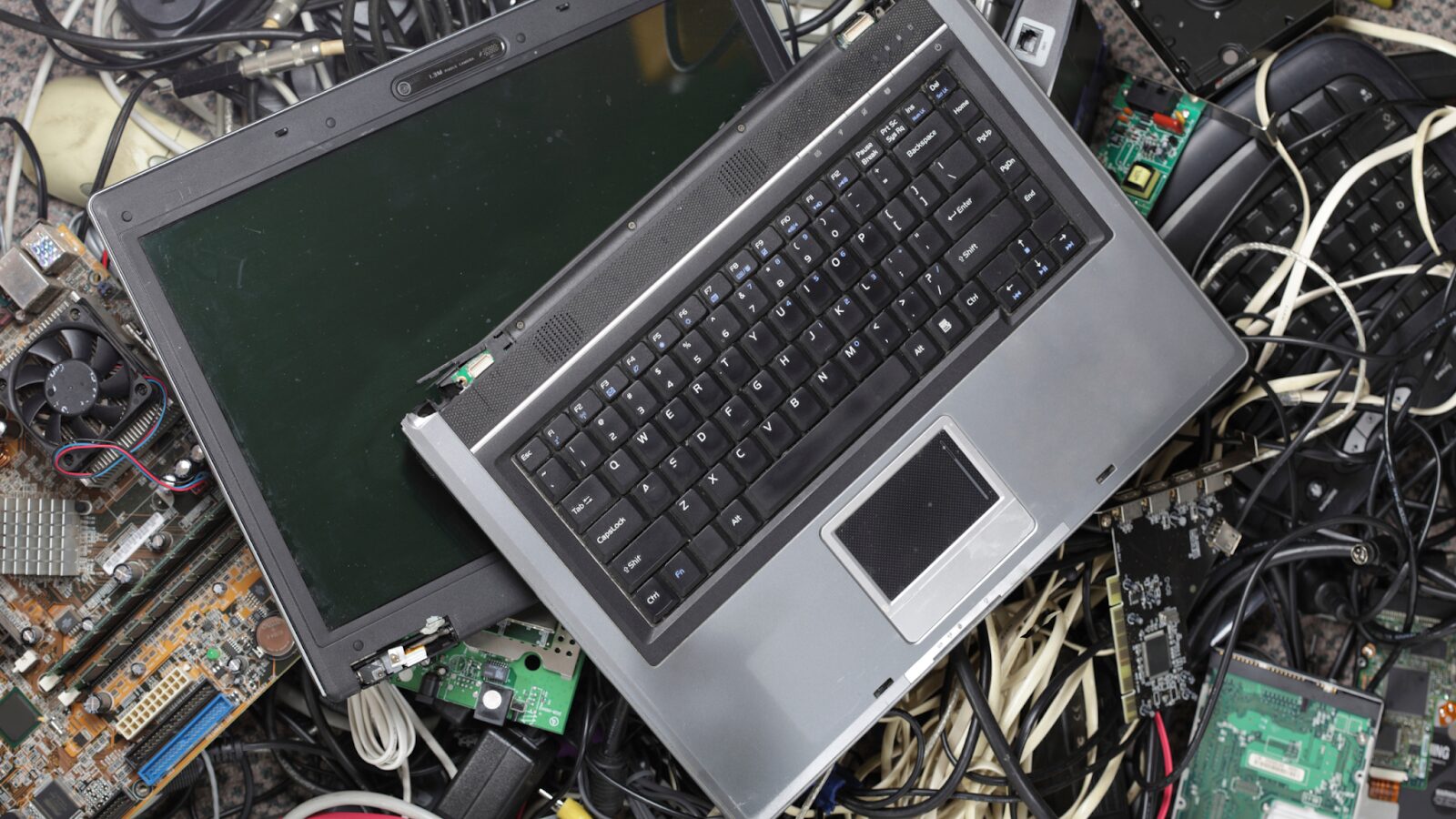 Pile of obsolete computers and IT equipment awaiting disposal and recycling